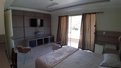 Uma cama ou camas num quarto em Alugo ótima casa , Centro Bombinhas!