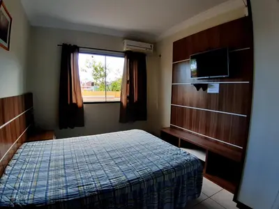 Uma cama ou camas num quarto em Alugo ótima casa , Centro Bombinhas!