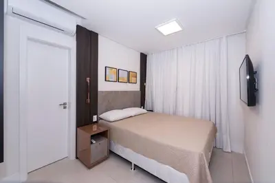 Uma cama ou camas num quarto em Adra 205 - Apartamento com 3 quartos - Centro de Bombinhas