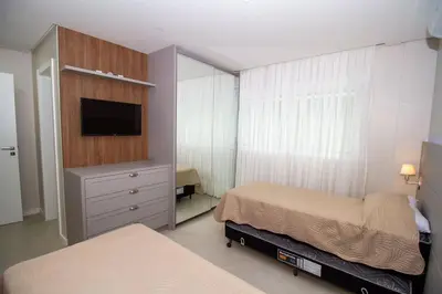 Uma cama ou camas num quarto em Puntarenas 204 - Apto 2 suítes à 80 metros da Praia do Mariscal