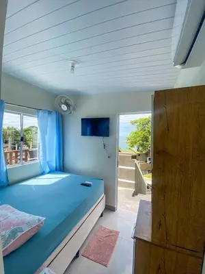 Uma cama ou camas num quarto em Pousada Mirante do César