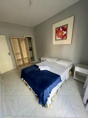 Uma cama ou camas num quarto em Dax Bombinhas