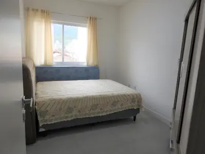 Uma cama ou camas num quarto em Apartamento Evora 300m da Praia