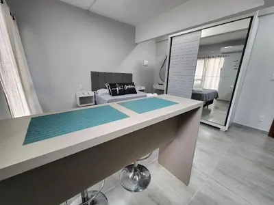 Uma televisão e/ou sistema de entretenimento em Loft na av. Meia Praia, Itapema