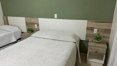 Uma cama ou camas num quarto em Residencial Costa Marfim