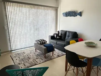 Uma área de estar em Encanto de apartamento, novo! A 290 metros da praia do Canto Grande!