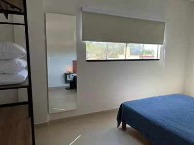 Uma cama ou camas num quarto em Encanto de apartamento, novo! A 290 metros da praia do Canto Grande!
