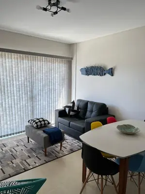 Uma área de estar em Encanto de apartamento, novo! A 290 metros da praia do Canto Grande!