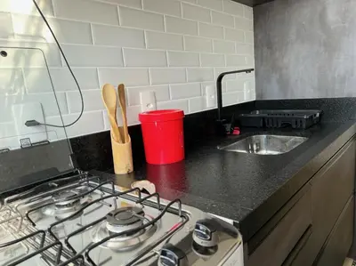 A cozinha ou kitchenette de Encanto de apartamento, novo! A 290 metros da praia do Canto Grande!