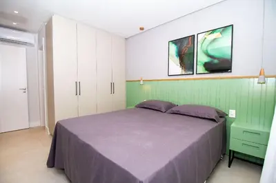 Uma cama ou camas num quarto em Adra 304 - Apartamento com 3 quartos - Centro de Bombinhas