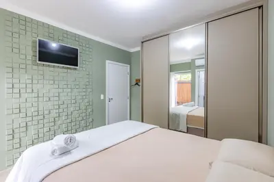 Uma cama ou camas num quarto em Apartamento 2 quartos com Spá Expocentro Praias