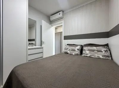 Uma cama ou camas num quarto em Residencial Luize 302 - Apto para 7 pessoas na Praia de Palmas a 350m do mar