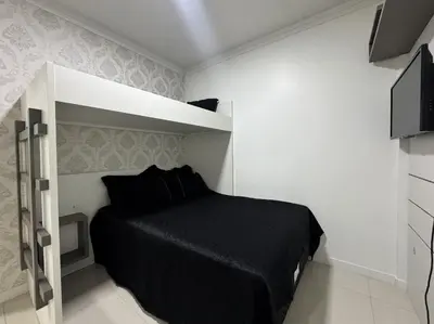 Uma televisão e/ou sistema de entretenimento em Residencial Luize 302 - Apto para 7 pessoas na Praia de Palmas a 350m do mar