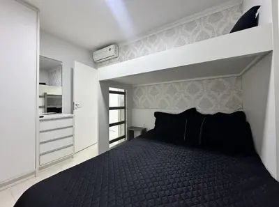 Uma cama ou camas num quarto em Residencial Luize 302 - Apto para 7 pessoas na Praia de Palmas a 350m do mar