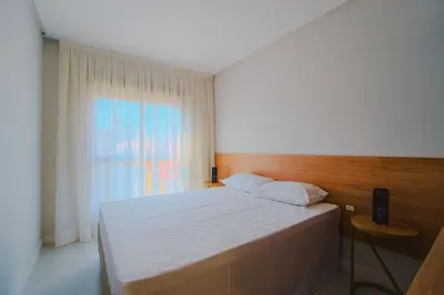 Uma cama ou camas num quarto em Apartamento pertinho da Praia de Bombinhas