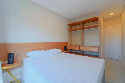 Uma cama ou camas num quarto em Apartamento pertinho da Praia de Bombinhas