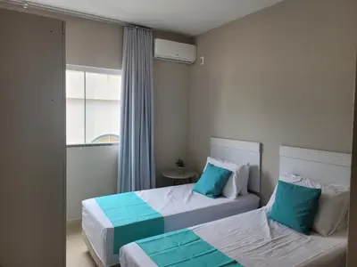 Uma cama ou camas num quarto em Apartamento com 2 quartos no centro de Tijucas 105