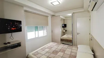 Uma cama ou camas num quarto em 1017 - Praia de Bombinhas locação de temporada - Residencial Egídio Pinheiro Apto 306A