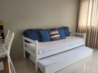 Uma cama ou camas num quarto em Apartamento aconchegante em Tijucas kit 11