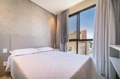 Uma cama ou camas num quarto em Aluguel Moderno Apartamento 3 quartos