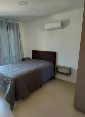 Uma cama ou camas num quarto em Amplo apto 3 suítes
