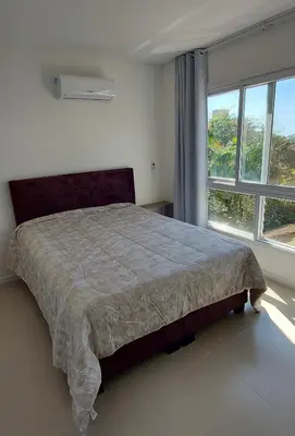 Uma cama ou camas num quarto em Amplo apto 3 suítes