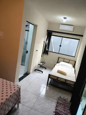 Uma cama ou camas num quarto em Casa de Praia Família Próximo ao ExpoCentro BC