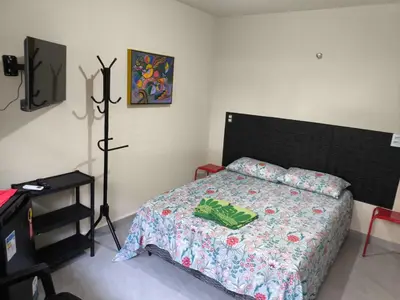 Uma cama ou camas num quarto em Casa de Praia Família Próximo ao ExpoCentro BC