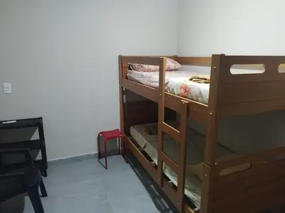 Uma cama ou camas num quarto em Casa de Praia Família Próximo ao ExpoCentro BC
