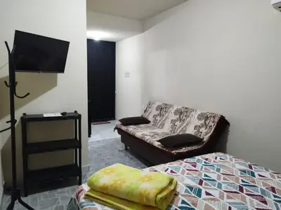 Uma cama ou camas num quarto em Casa de Praia Família Próximo ao ExpoCentro BC