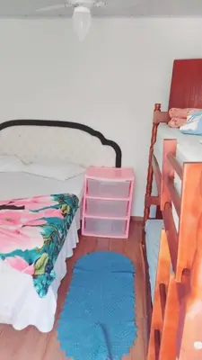Uma cama ou camas num quarto em Casas de Aluguel da Lulu