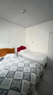 Uma cama ou camas num quarto em Casas de Aluguel da Lulu