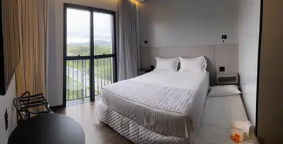 Uma cama ou camas num quarto em Tri Hotel Premium Itapema