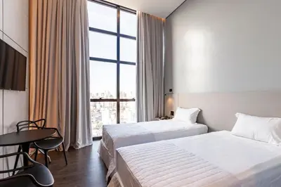 Uma cama ou camas num quarto em Tri Hotel Premium Itapema