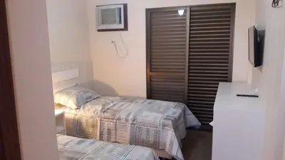 Uma cama ou camas num quarto em Duplex Costa Esmeralda