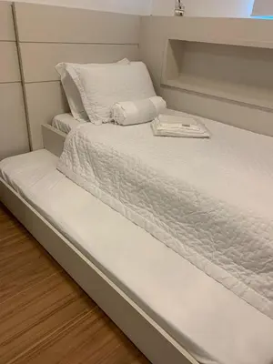Uma cama ou camas num quarto em Encanto dos Mares - Apartamento premium 4