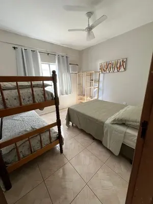 Uma cama ou camas num quarto em Residencial Nereu