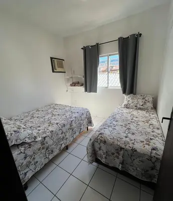 Uma cama ou camas num quarto em Residencial Nereu