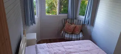 Uma cama ou camas num quarto em Casa 2, 3 ou 4 pessoas vista incrível com piscina centro Bombinhas carro 4x4 ou potente