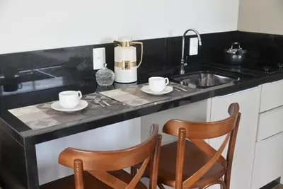A cozinha ou kitchenette de Vila do Centro Apart Hotel