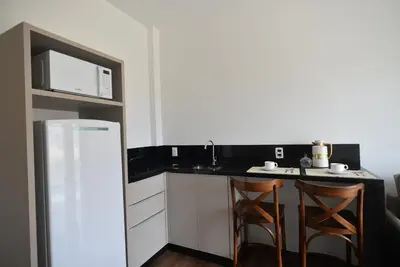 A cozinha ou kitchenette de Vila do Centro Apart Hotel