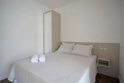 Uma cama ou camas num quarto em Vila do Centro Apart Hotel
