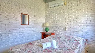 Uma cama ou camas num quarto em #005 Casa 2 minutos a pé da praia de Palmas