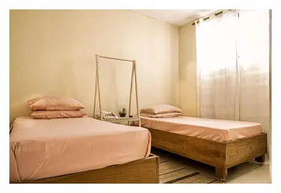 Uma cama ou camas num quarto em Casa Familiar Estaleiro
