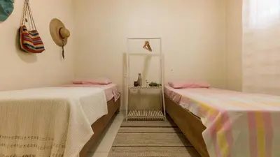 Uma cama ou camas num quarto em Casa Familiar Estaleiro