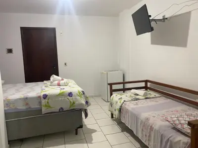 Uma cama ou camas num quarto em Hotel Interpraias