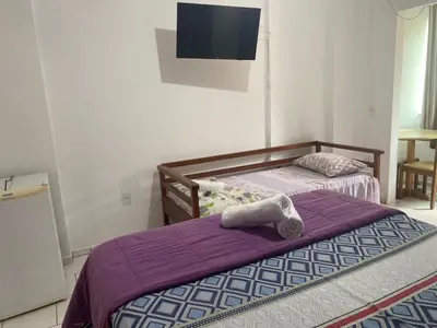 Uma cama ou camas num quarto em Hotel Interpraias