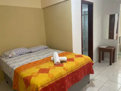Uma cama ou camas num quarto em Hotel Interpraias