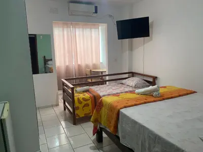 Uma cama ou camas num quarto em Hotel Interpraias