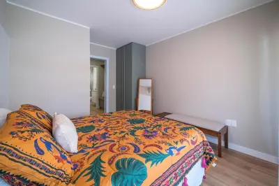 Uma cama ou camas num quarto em A sua casa na praia com jacuzzi aquecida
